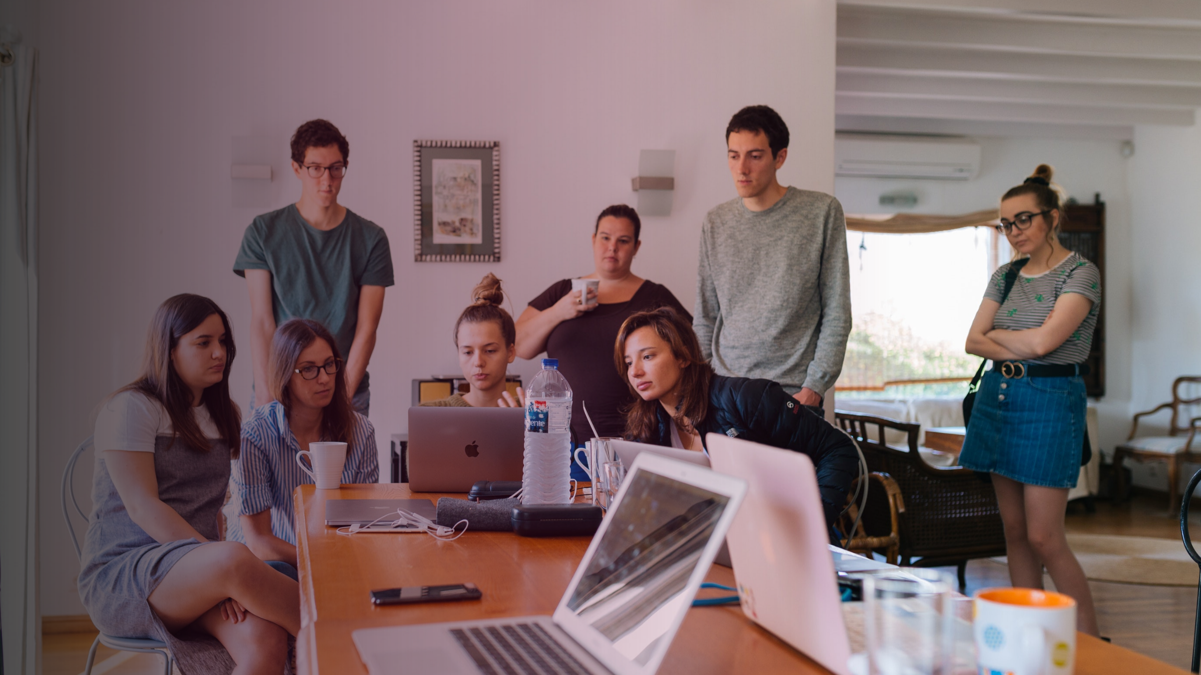Disinterested team looking at a shared work screen